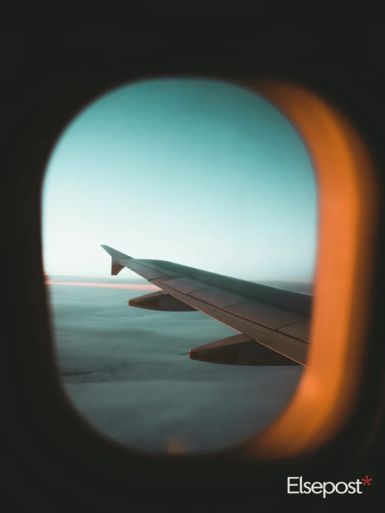 Aeroplane wing seen through a cabin window, for the Air India Express winter schedule