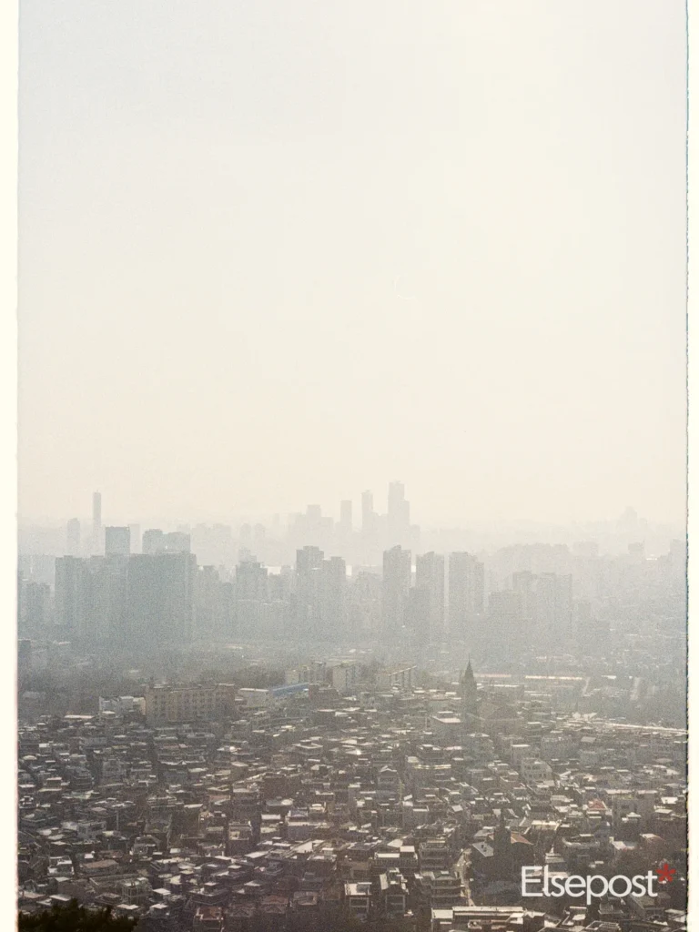 Hazy city skyline showing why AQI categories India uses matter