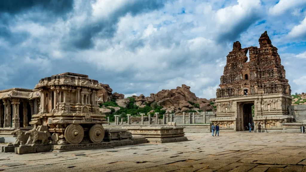 Stone temple structures among boulders at Hampi