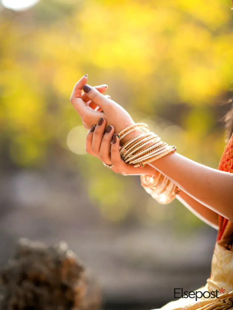 Hands adorned with bangles, for HUID gold hallmark check