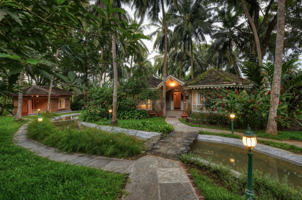 Villas at Kairali Ayurvedic Healing Village at dusk, Palakkad