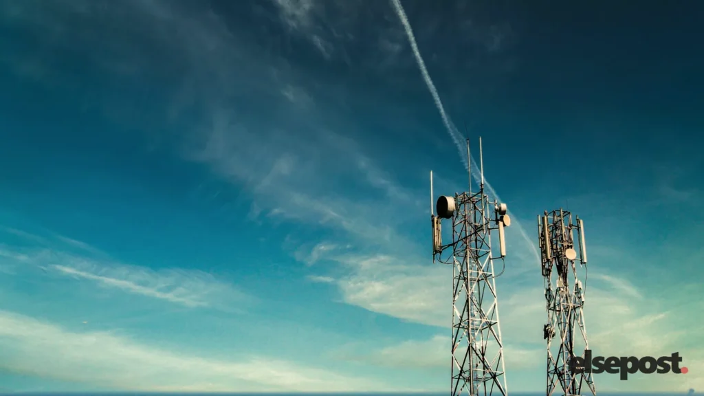 Black metal telecom tower under a blue sky, illustrating the Jio Platforms share price listing