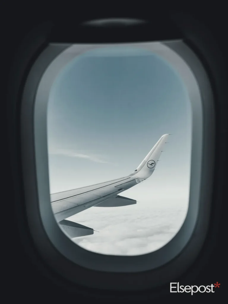 white aeroplane wing in the sky for Navi Mumbai Airport Shift