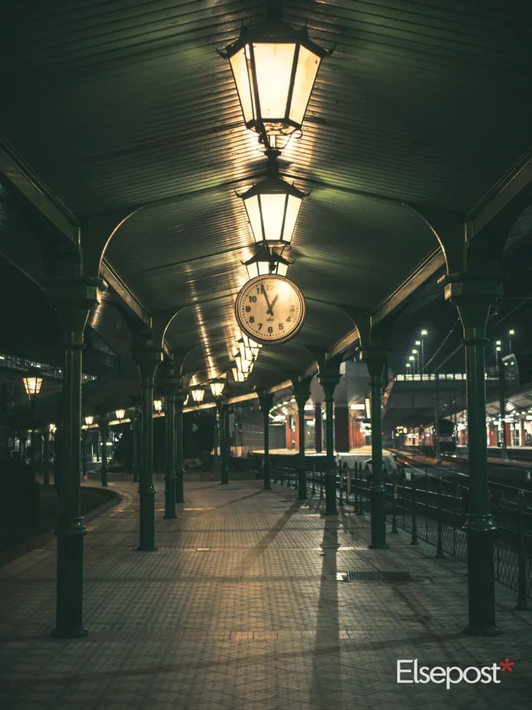 Railway platform with a hanging clock, used for railway chart preparation time