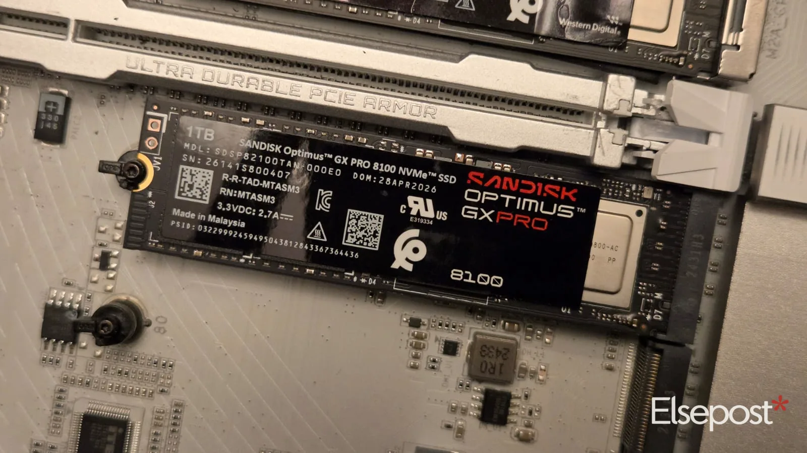 SanDisk Optimus GX Pro 8100 1TB SSD installed in the PCIe 5.0 M.2 slot of a motherboard