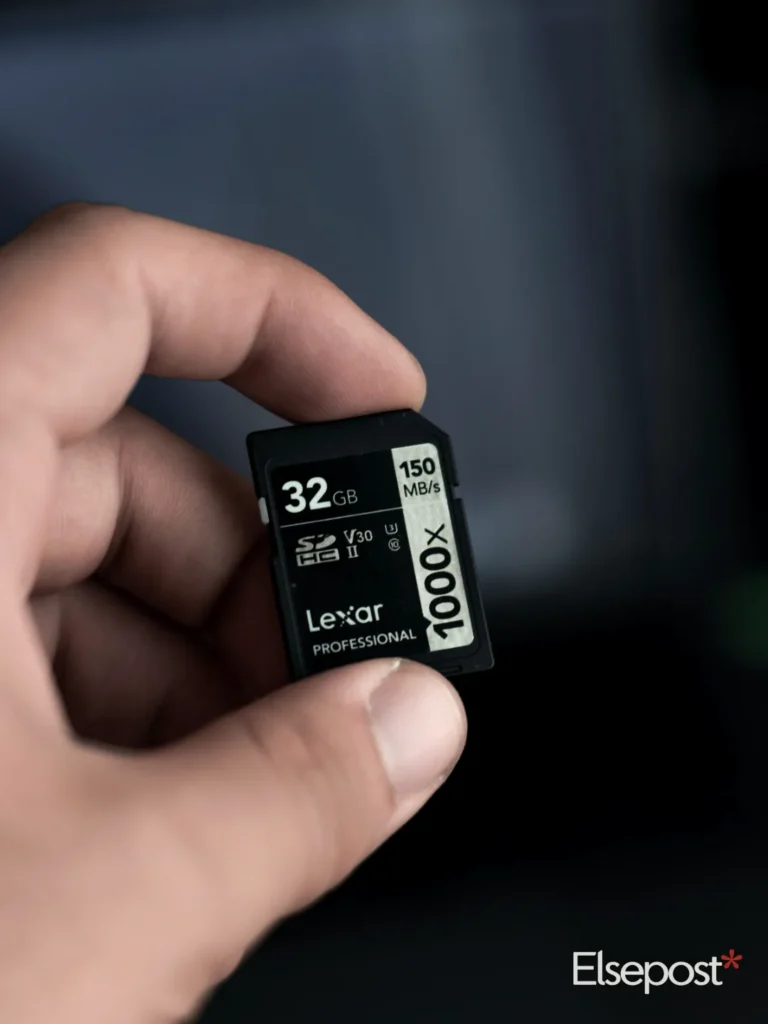 hand holding a micro SD memory card for SanDisk Optimus GX Pro 8100 Review