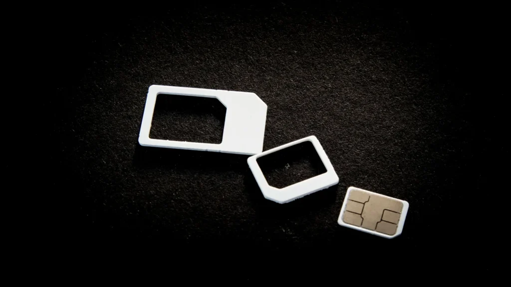 Standard, micro and nano SIM cards registered to mobile users, shown on a dark surface