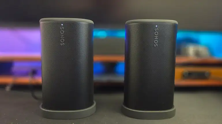 Two black Sonos Play speakers standing side by side as a stereo pair