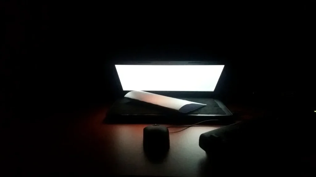 Laptop open on a brown table, touchscreen MacBook Pro price in India