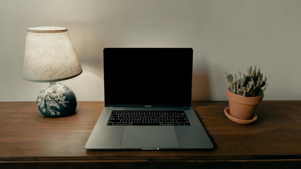 Laptop on a brown wooden table, which MacBook Pro to buy in India